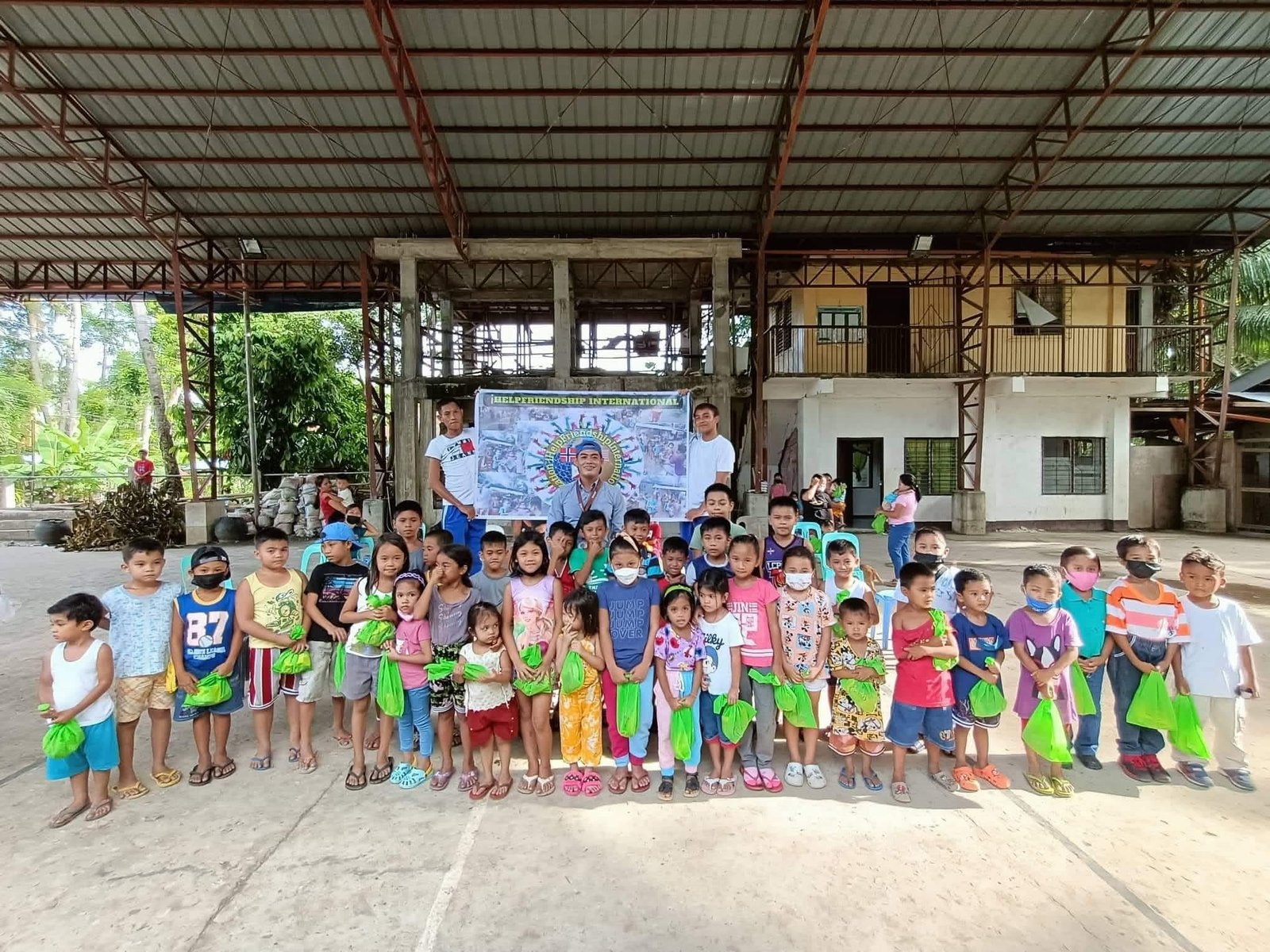Group gathered at an ihelpfriendship community activity in Bohol