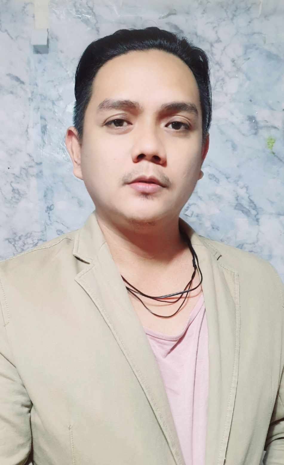 Client-supplied portrait identified as Gilly Paul Pasao