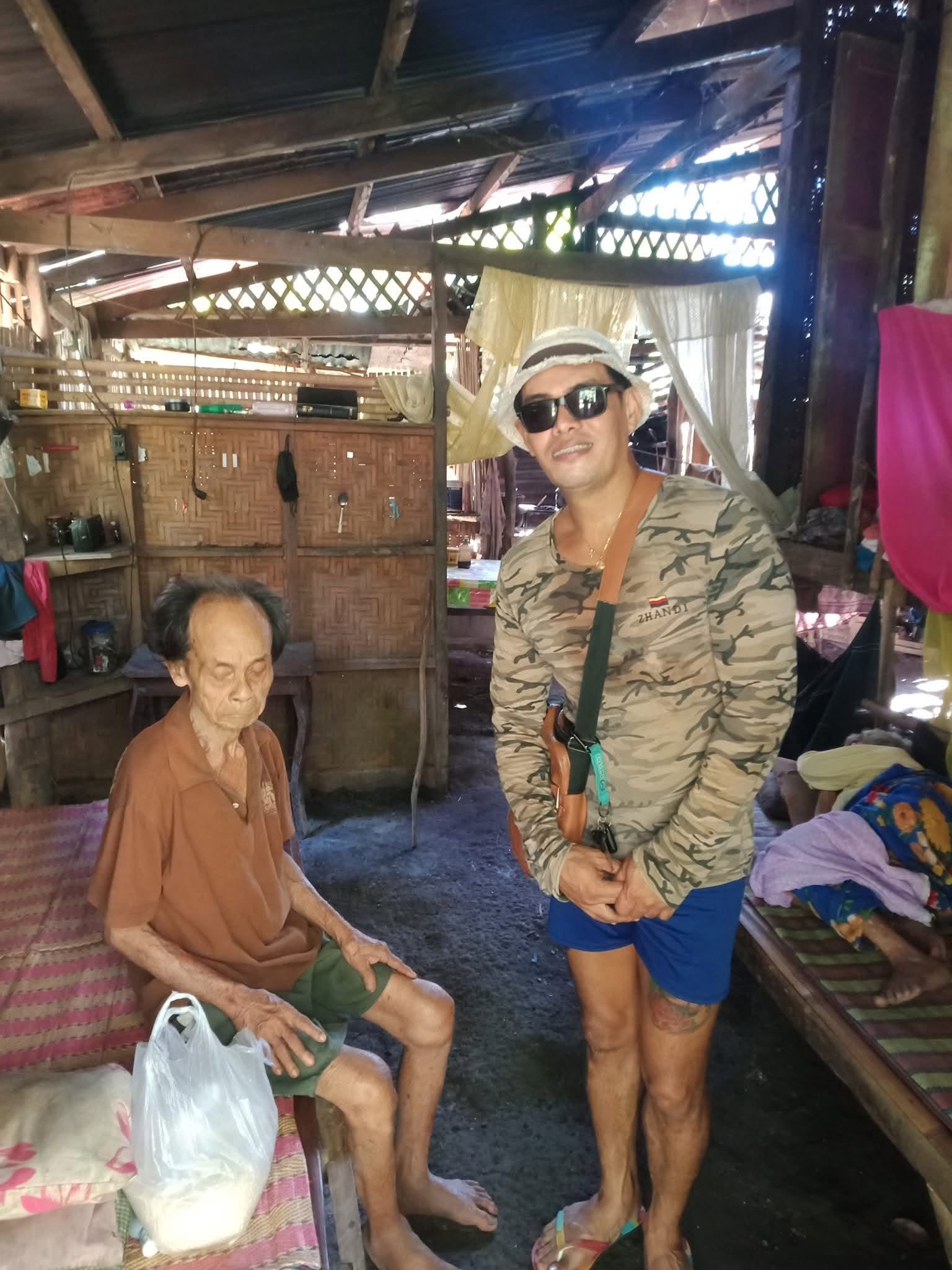 An older man with a volunteer during a home visit